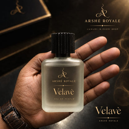 Hand holding Arshè Royale Velavè Eau de Parfum bottle, “Luxury in every drop”